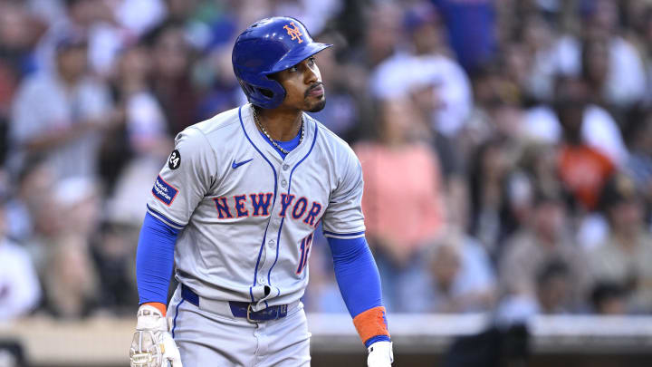 Aug 24, 2024; San Diego, California, USA; New York Mets shortstop Francisco Lindor (12) hits a grand slam home run against the San Diego Padres during the fourth inning at Petco Park. Mandatory Credit: Orlando Ramirez-USA TODAY Sports