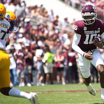 Sep 7, 2024; College Station, Texas, USA; Texas A&M Aggies quarterback Marcel Reed (10) runs the ball against the McNeese State Cowboys during the second quarter at Kyle Field.