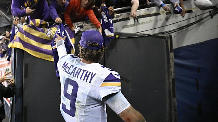 Minnesota Vikings quarterback J.J. McCarthy reacts after defeating the Chicago Bears at Soldier Field.