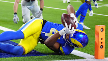 Dec 28, 2024; Inglewood, California, USA; Los Angeles Rams cornerback Ahkello Witherspoon (4) intercepts a pass with 42 seconds left against the Arizona Cardinals at SoFi Stadium. Mandatory Credit: Kirby Lee-Imagn Images