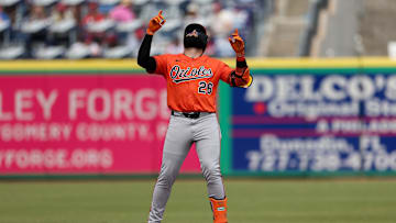 Baltimore Orioles designated hitter Emmanuel Rivera doubles against the Philadelphia Phillies in the second inning during spring training at BayCare Ballpark.