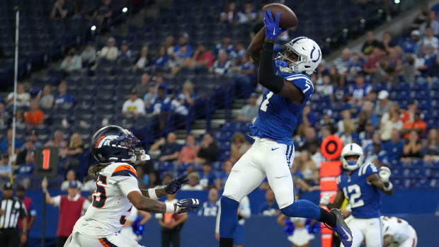 Colts receiver Laquon Treadwell (blue jersey with white helmet) makes a catch for a touchdown. 