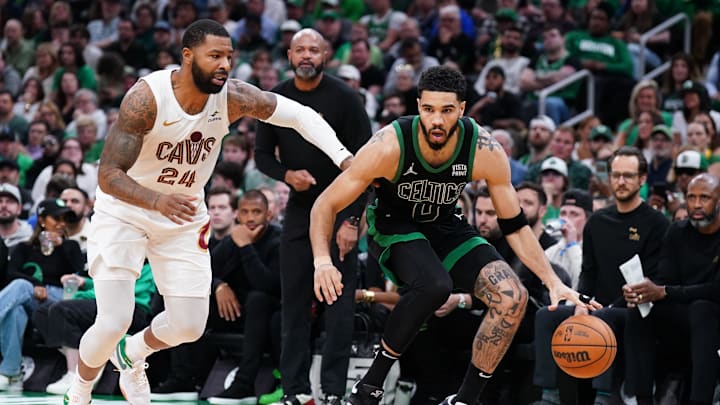 May 15, 2024; Boston, Massachusetts, USA; Boston Celtics forward Jayson Tatum (0) drives the ball against Cleveland Cavaliers forward Marcus Morris Sr. (24) in the third quarter during game five of the second round for the 2024 NBA playoffs at TD Garden. Mandatory Credit: David Butler II-Imagn Images