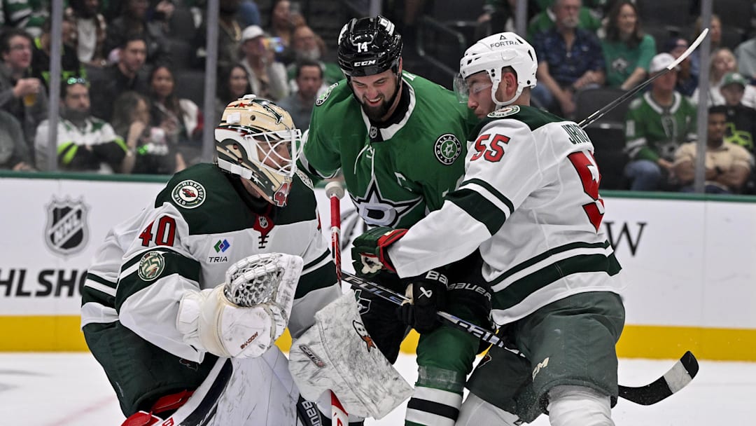 Sep 23, 2025; Dallas, Texas, USA; Minnesota Wild goaltender Cal Petersen (40) and defenseman David Jiricek (55) and Dallas Stars left wing Jamie Benn (14) in action during the game between the Dallas Stars and the Minnesota Wild at American Airlines Center. Mandatory Credit: Jerome Miron-Imagn Images
