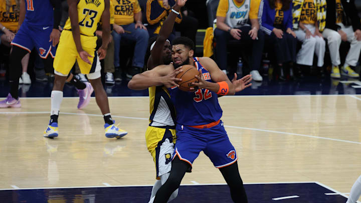 Towns works the paint against Pascal Siakam.