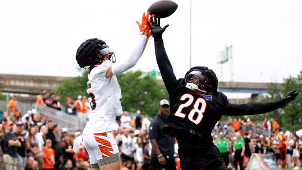 Bengals rookie cornerback Josh Newton, right, defends a pass to wide receiver Charlie Jones in training camp.