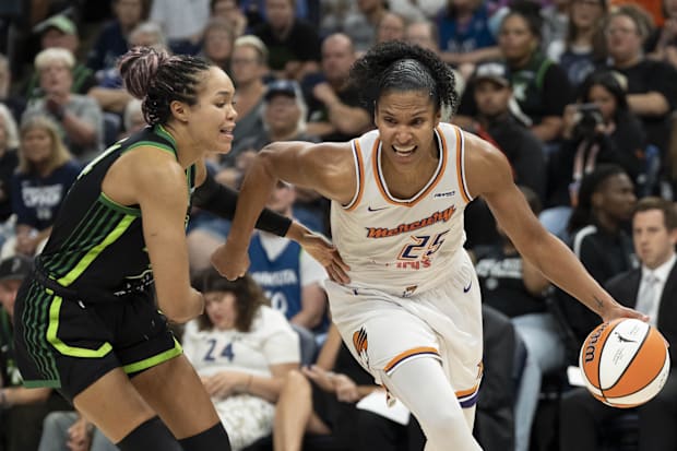 Phoenix Mercury forward Alyssa Thomas (25) dribbles past Minnesota Lynx forward Napheesa Collier