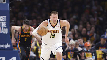 Denver Nuggets center Nikola Jokic dribbles against the Oklahoma City Thunder during Game 1 of the second round in the 2025 NBA Playoffs. 