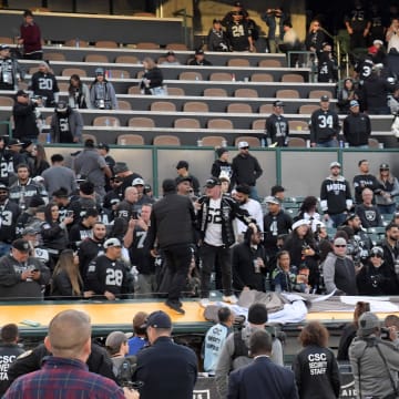 Dec 15, 2019; Oakland, CA, USA; Oakland Raiders tear down banners after the Raiders final game