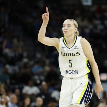 Dallas Wings guard Paige Bueckers reacts after scoring against the Chicago Sky during the first half at Wintrust Arena.