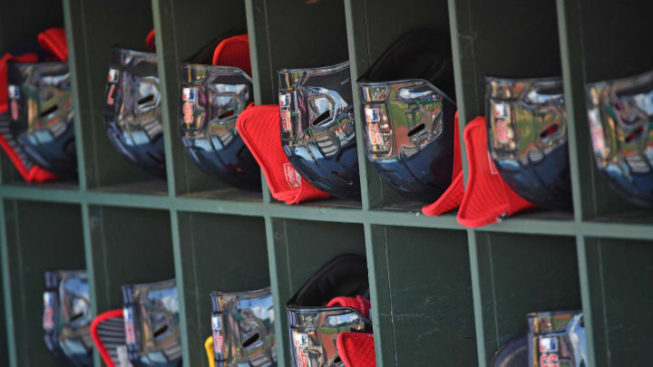 St. Louis Cardinals batting helmets in the dugout against the Philadelphia Phillies at Citizens Bank Park in 2023.