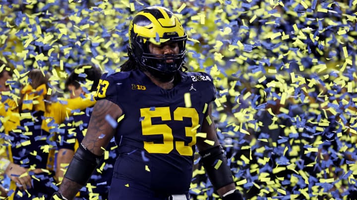 Jan 8, 2024; Houston, TX, USA; Michigan Wolverines offensive lineman Trente Jones (53) walks in confetti after beating the Washington Huskies in the 2024 College Football Playoff national championship game at NRG Stadium. Mandatory Credit: Troy Taormina-USA TODAY Sports