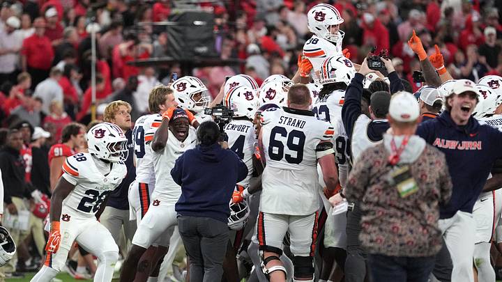 Oct 17, 2026; Athens, Georgia, USA;  Auburn celebrates following a game-winning field goal by Auburn kicker Alex McPherson (38) during the fourth quarter against Georgia at Sanford Stadium.  Mandatory Credit: Dale Zanine-Imagn Images