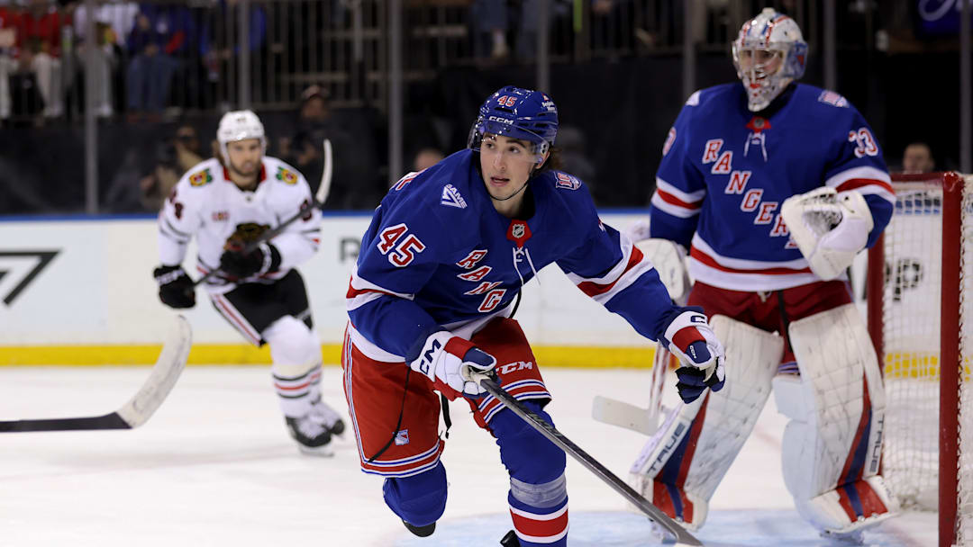 Mar 27, 2026; New York, New York, USA; New York Rangers defenseman Drew Fortescue (45) and goaltender Dylan Garand (33) skate against the Chicago Blackhawks during the first period at Madison Square Garden. Mandatory Credit: Brad Penner-Imagn Images