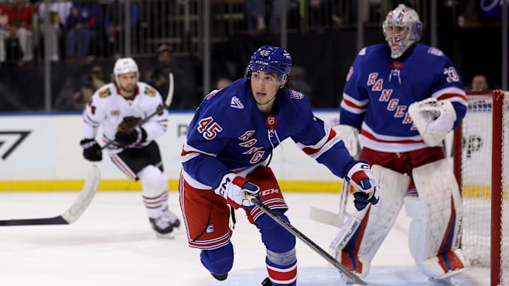Mar 27, 2026; New York, New York, USA; New York Rangers defenseman Drew Fortescue (45) and goaltender Dylan Garand (33) skate against the Chicago Blackhawks during the first period at Madison Square Garden. Mandatory Credit: Brad Penner-Imagn Images