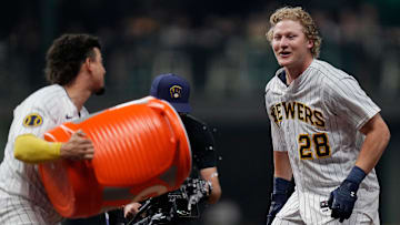 Milwaukee Brewers shortstop Willy Adames (27) dumps gatorade on center fielder Joey Wiemer (28) after he hit a sacrifice fly to Kansas City Royals center fielder Jackie Bradley Jr. (41) allowing Brewers right fielder Brian Anderson (9) to score during the ninth inning on Saturday May 13, 2023 at American Family Field in Milwaukee, Wis.