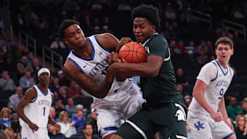 Nov 18, 2025; New York, New York, USA; Kentucky Wildcats forward Brandon Garrison (10) and Michigan State Spartans forward Cameron Ward (3) battle for a rebound during the first half at Madison Square Garden. Mandatory Credit: Vincent Carchietta-Imagn Images