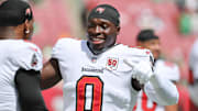 Sep 28, 2025; Tampa, Florida, USA; Tampa Bay Buccaneers outside linebacker Yaya Diaby (0) speaks with a teammate during warm ups  prior to the game against the Philadelphia Eagles at Raymond James Stadium. Mandatory Credit: Kim Klement Neitzel-Imagn Images