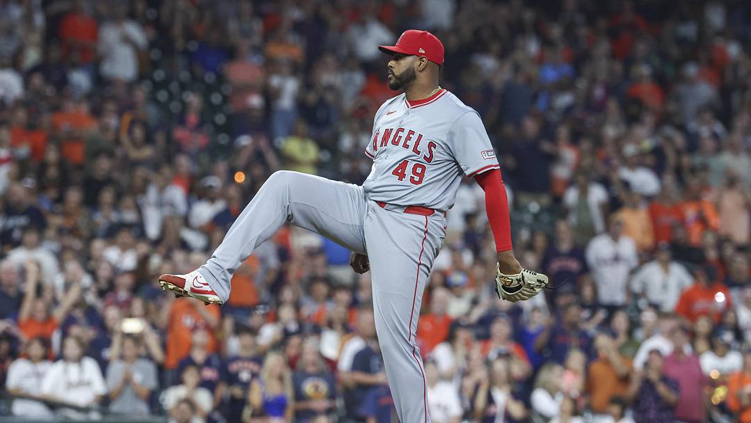 Sep 22, 2024; Houston, Texas, USA; Los Angeles Angels relief pitcher Guillermo Zuniga (49) reacts after the final out during the ninth inning against the Houston Astros at Minute Maid Park. Mandatory Credit: Troy Taormina-Imagn Images