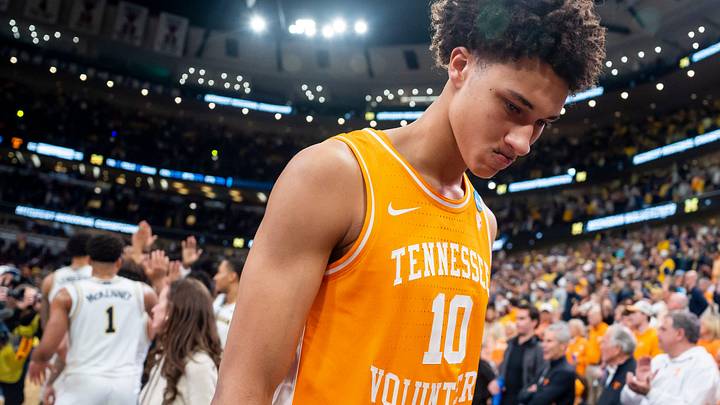 Tennessee forward Nate Ament (10) walks off the court as Michigan players celebrate their Final Four berth behind him after a NCAA Tournament Elite 8 game between Tennessee and Michigan at the United Center in Chicago on March 29, 2026.