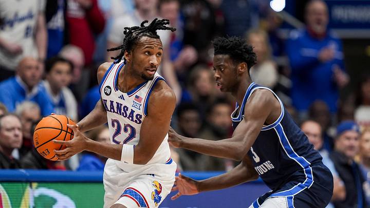 Jan 24, 2026; Columbia, Missouri, USA; Kansas Jayhawks guard Darryn Peterson (22) looks to pass against BYU Cougars forward AJ Dybantsa (3) during the first half at Mizzou Arena. Mandatory Credit: Jay Biggerstaff-Imagn Images