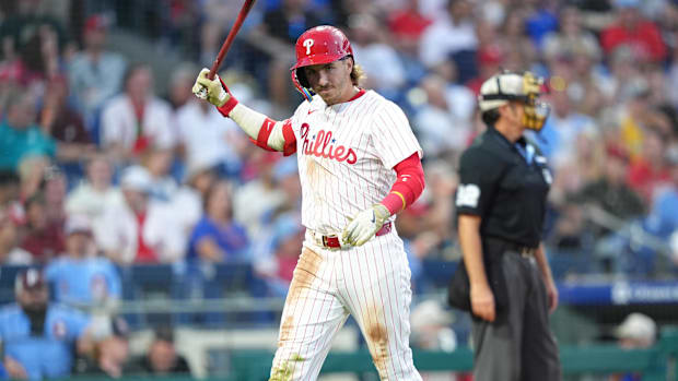 Phillies player Bryson Stott walks back to the dugout after striking out against the Pirates