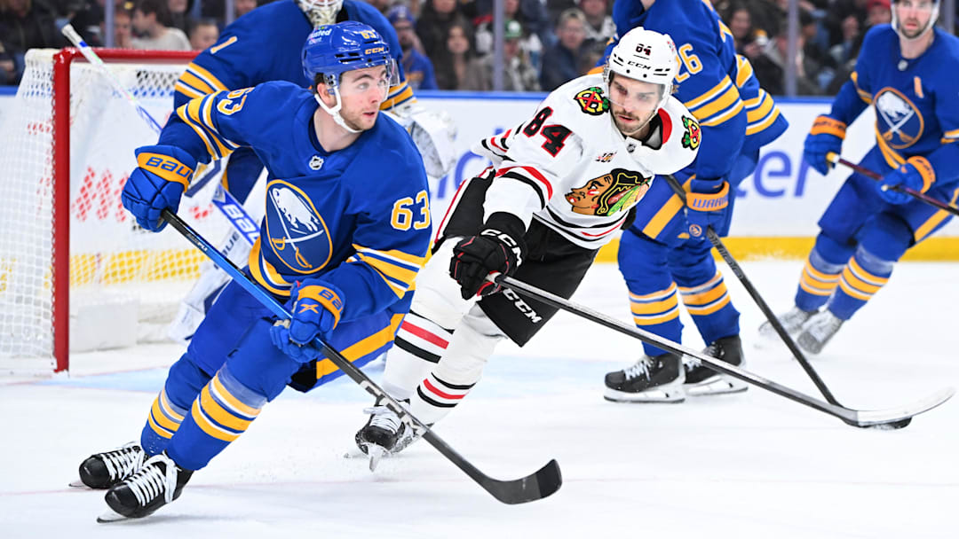 Buffalo Sabres right wing Isak Rosen (63) moves the puck away from Chicago Blackhawks left wing Landon Slaggert (84) at KeyBank Center. 