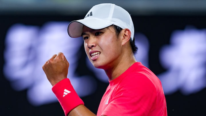 American tennis player Learner Tien reacts to winning a point vs. Daniil Medvedev at the Australian Open.
