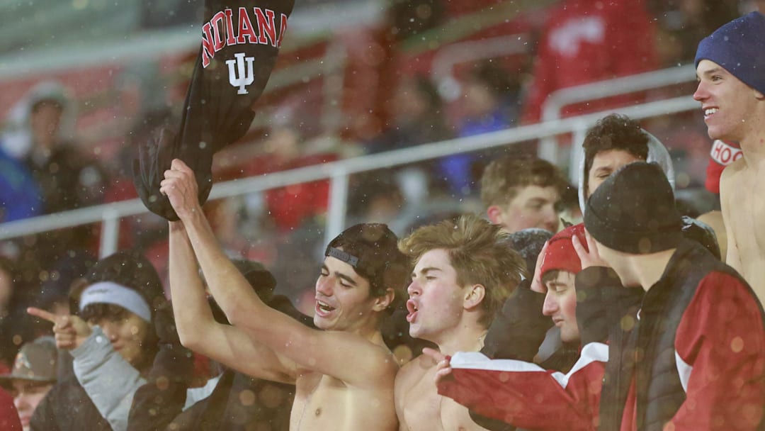 Indiana University fans cheer during an NCAA football game...