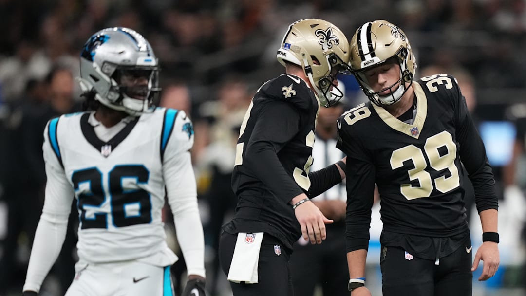 Dec 14, 2025; New Orleans, Louisiana, USA; New Orleans Saints place kicker Charlie Smyth (39) celebrates with punter Kai Kroeger (32) after a field goal during the third quarter against the Carolina Panthers at Caesars Superdome. Mandatory Credit: Matthew Hinton-Imagn Images
