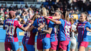 FC Barcelona players celebrate after scoring a goal during...