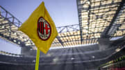 A corner flag bearing the logo of AC Milan is seen during...