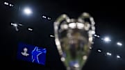 A scoreboard displays the logo of the UEFA Champions League...