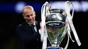 Zinedine Zidane, former football player, holds the trophy...