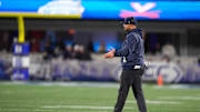 Dec 6, 2025; Charlotte, NC, USA; Virginia Cavaliers head coach Tony Elliott greets players during the second half against the Duke Blue Devils during the 2025 ACC Championship game at Bank of America Stadium. Mandatory Credit: Jim Dedmon-Imagn Images