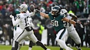 Dec 14, 2025; Philadelphia, Pennsylvania, USA; Las Vegas Raiders quarterback Kenny Pickett (15) throws the ball as Philadelphia Eagles linebacker Jaelan Phillips (50) attempts to block during the second quarter at Lincoln Financial Field. Mandatory Credit: Eric Hartline-Imagn Images