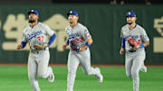 Mar 18, 2025; Bunkyo, Tokyo, JPN; Los Angeles Dodgers oiutfielders Teoscar Hernández (37), Michael Conforto (23), and Andy Pages (44) celebrate after defeating the Chicago Cubs during the Tokyo Series at Tokyo Dome. Mandatory Credit: Darren Yamashita-Imagn Images