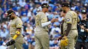Oct 1, 2025; Chicago, Illinois, USA; San Diego Padres relief pitcher Robert Suarez (75) celebrates with teammates after the final out for the win against the Chicago Cubs in the ninth inning during game two of the Wildcard round for the 2025 MLB playoffs at Wrigley Field. Mandatory Credit: Matt Marton-Imagn Images