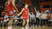 Feb 3, 2024; El Paso, Texas, USA; Liberty University Flames guard Kaden Metheny (3) celebrates after scoring a three pointer against the UTEP Miners defense in the first half at Don Haskins Center. Mandatory Credit: Ivan Pierre Aguirre-Imagn Images