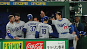 Mar 18, 2025; Bunkyo, Tokyo, JPN; Los Angeles Dodgers designated hitter Shohei Ohtani (17) celebrates with outfielder Teoscar Hernández (37) (left) after scoring a run in the fifth inning against the Chicago Cubs during the Tokyo Series at Tokyo Dome. 