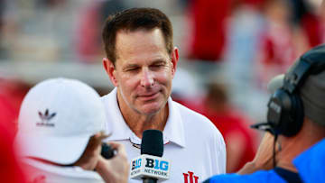 Indiana University football coach Curt Cignetti talks to the...