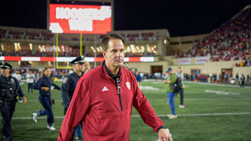 Indiana University coach Curt Cignetti walks off the field...