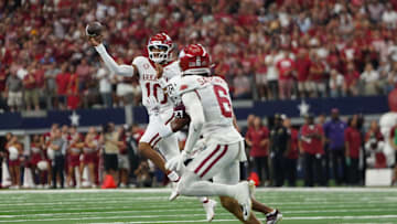 Arkansas Razorbacks quarterback Taylen Green #10 rolls the...
