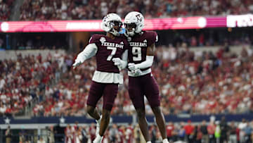 Texas A&M Aggies  Moose #7 and Jahdae Walker #9 celebrating...