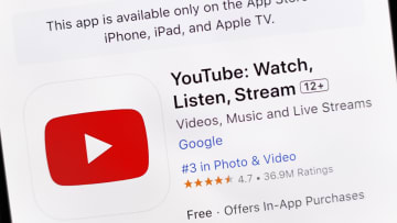 In this photo illustration, the YouTube app is seen on the...