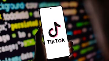 In this photo illustration, the TikTok logo is displayed on...