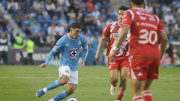 Erik Lira #6 of  Cruz Azul drives the ball forward during...