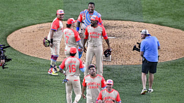 Jul 16, 2024; Arlington, Texas, USA; The American League players celebrate after the they defeat the National League in the 2024 MLB All-Star game at Globe Life Field. Mandatory Credit: Jerome Miron-Imagn Images