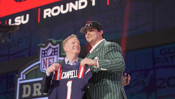 NFL commissioner Roger Goodell poses with Offensive Tackle Will Campbell of LSU after he is selected by the New England Patriots 