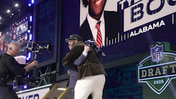 Tyler Booker poses after he is selected by the Dallas Cowboys as the No. 12 pick in the 2025 NFL Draft at Lambeau Field.